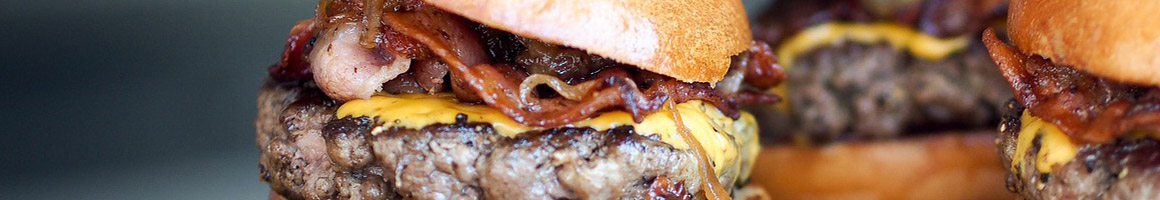 Eating Burger Hot Dog at Flip's Burgers restaurant in Stockton, CA.